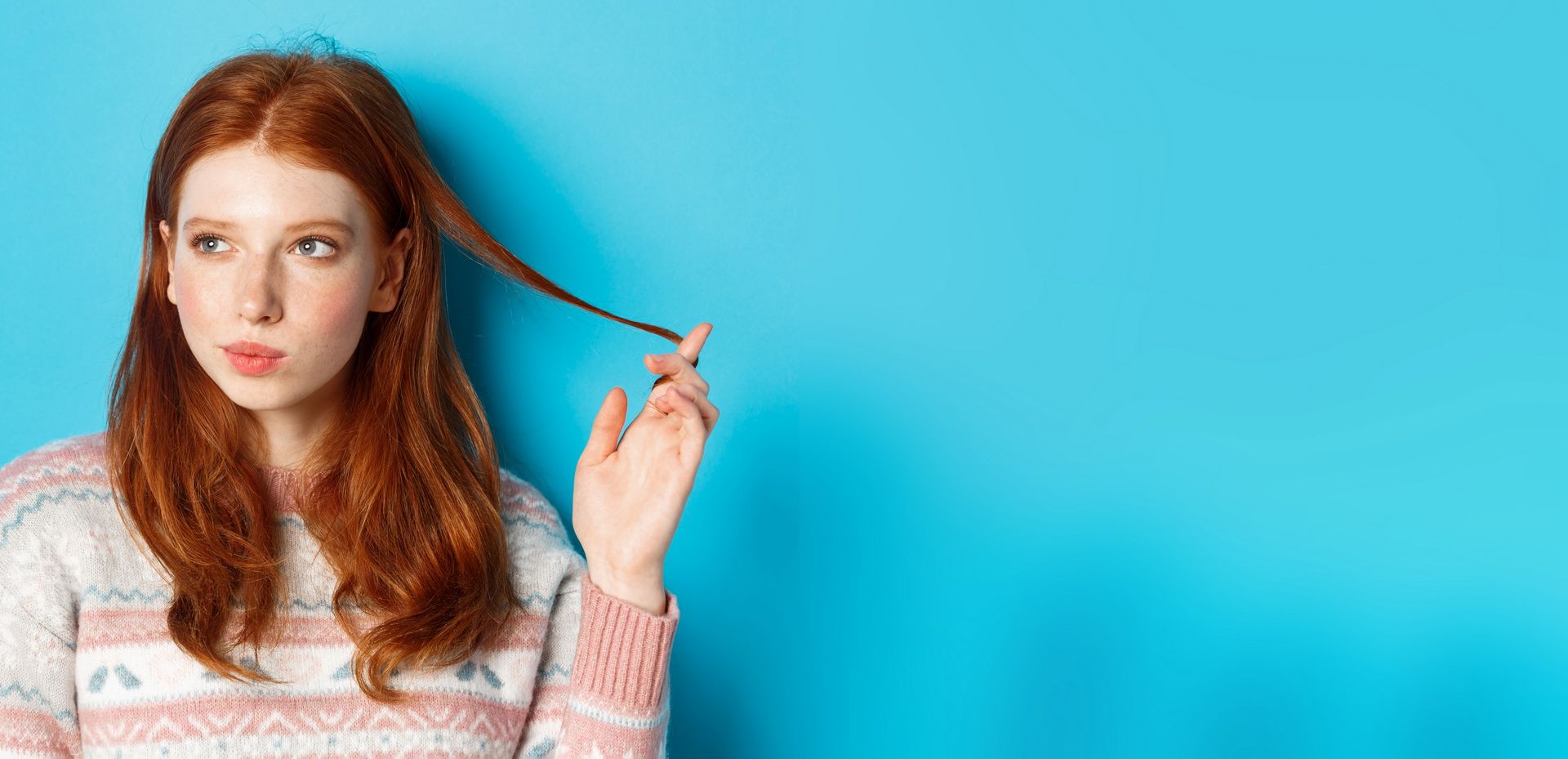 closeup-thoughtful-pretty-redhead-girl-looking-left-playing-with-hair-strand-pondering-standi.jpg